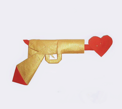Gun shooting out a heart